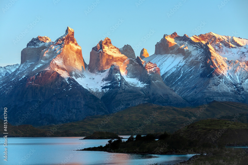 First rays of dawn sunlight on the Cordillera Paine in Torres Del Paine National Park - Chile - South America
