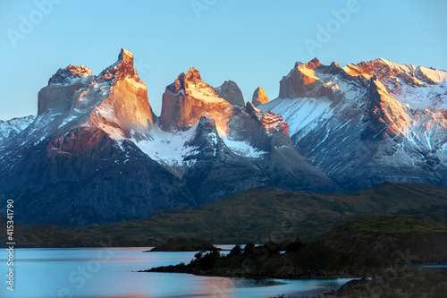 First rays of dawn sunlight on the Cordillera Paine in Torres Del Paine National Park - Chile - South America photo