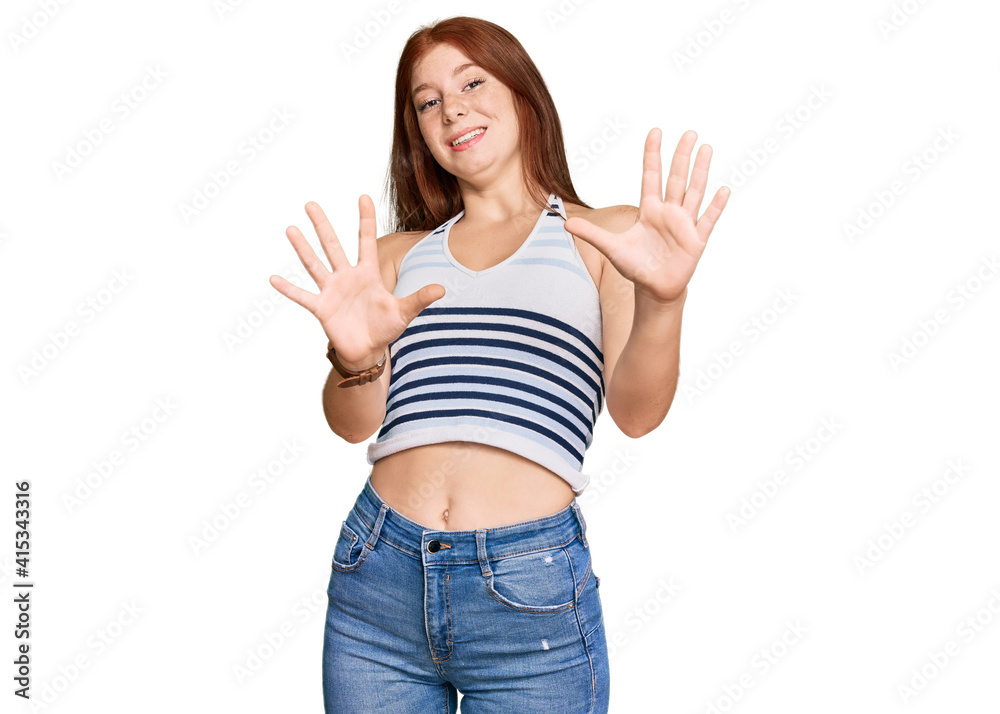 Young read head woman wearing casual clothes afraid and terrified with fear expression stop gesture with hands, shouting in shock. panic concept. Young read head woman wearing casual clothes afraid and terrified with fear expression stop gesture with hands, shouting in shock. panic concept.