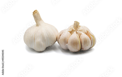 Garlic is a spice with a strong smell on a white background.