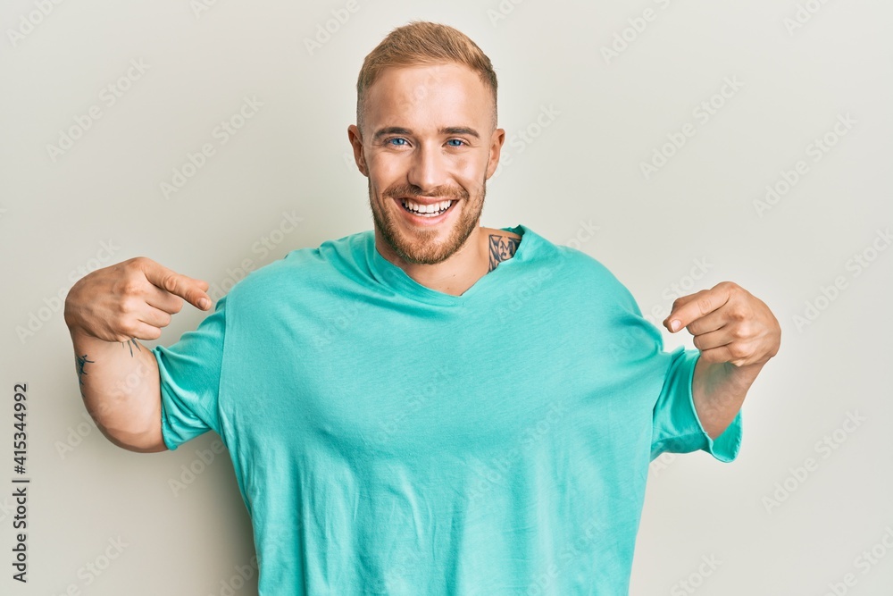 Young caucasian man wearing casual clothes looking confident with smile on face, pointing oneself with fingers proud and happy.