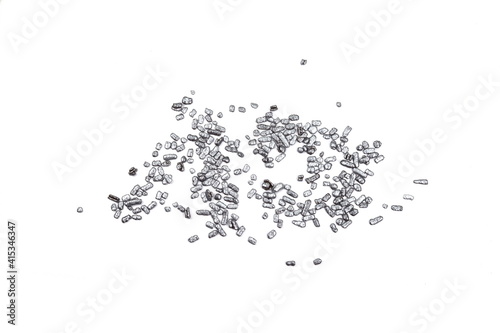 Silver sprinkles isolated on white background top view. Sweet silver glaze decoration or chocolate vermicelli