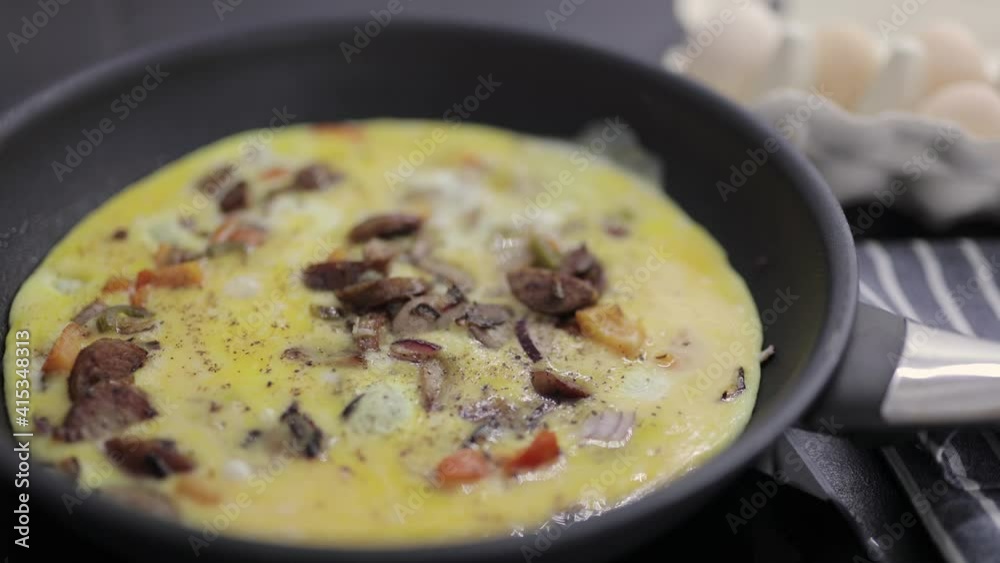 Preparation of an omelette for breakfast. Preparation of an omelette for breakfast.