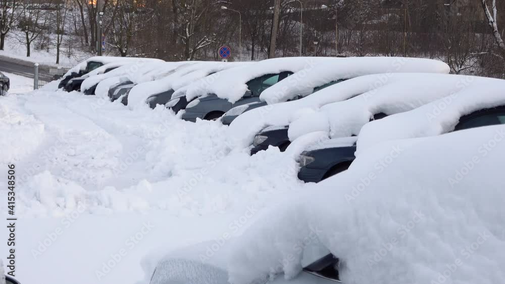 Car under thick blanket of snow after storm. Vehicles buried under ice. Nobody Car under thick blanket of snow after storm. Vehicles buried under ice. Nobody