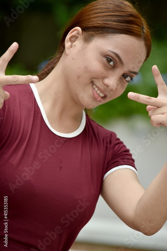 Female And Peace Sign Wearing Tshirt photo