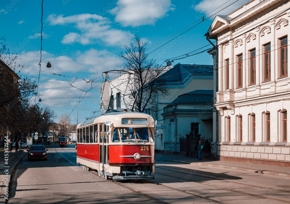 Fototapeta premium Vintage tram on the street in the historical city center. Moscow tram parade. 