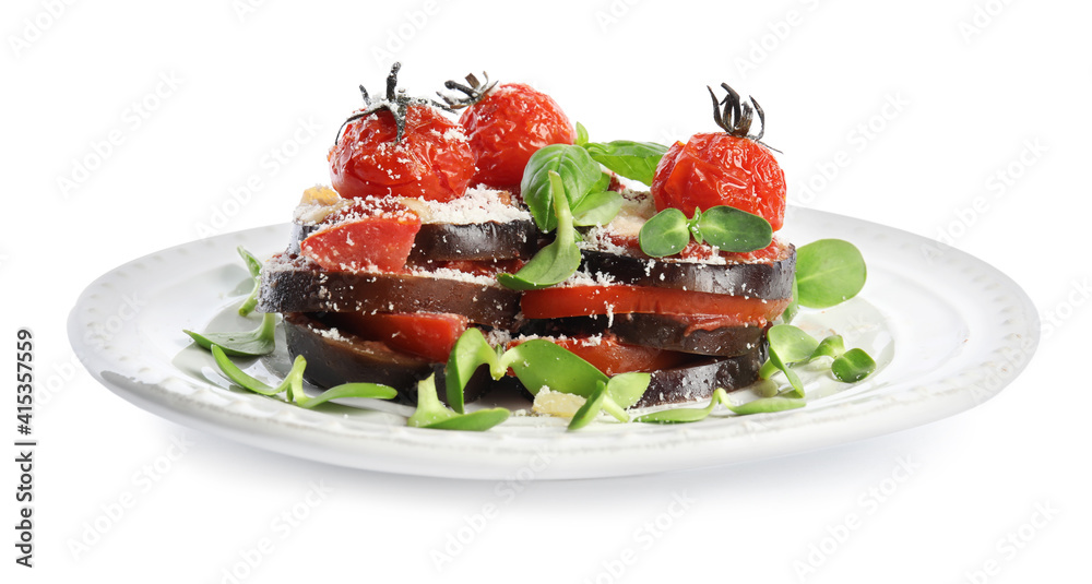 Baked eggplant with tomatoes, cheese and basil in plate isolated on white Baked eggplant with tomatoes, cheese and basil in plate isolated on white