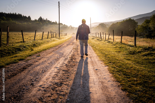 Person walking on an empty Road in the rural.