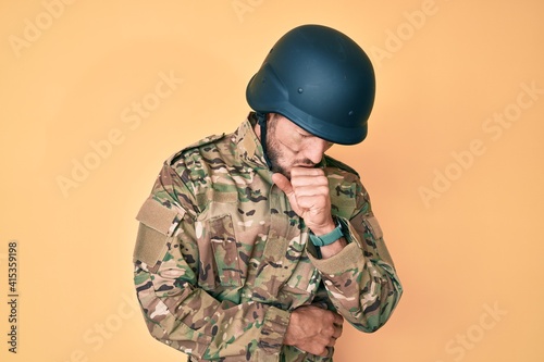 Young caucasian man wearing camouflage army uniform feeling unwell and coughing as symptom for cold or bronchitis. health care concept.