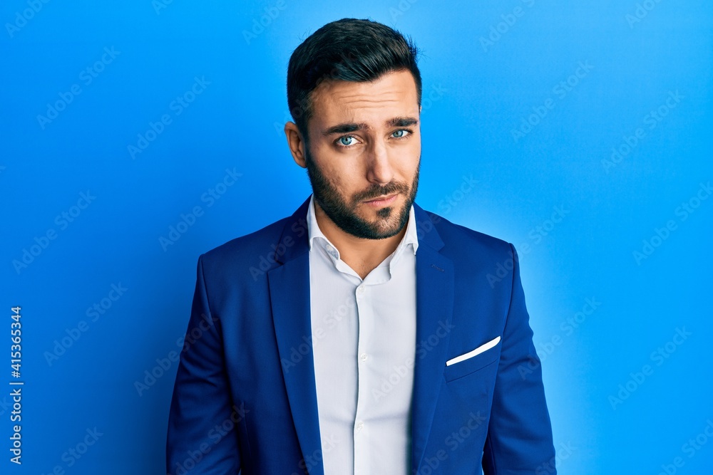 Young hispanic businessman wearing business jacket skeptic and nervous, frowning upset because of problem. negative person. Young hispanic businessman wearing business jacket skeptic and nervous, frowning upset because of problem. negative person.