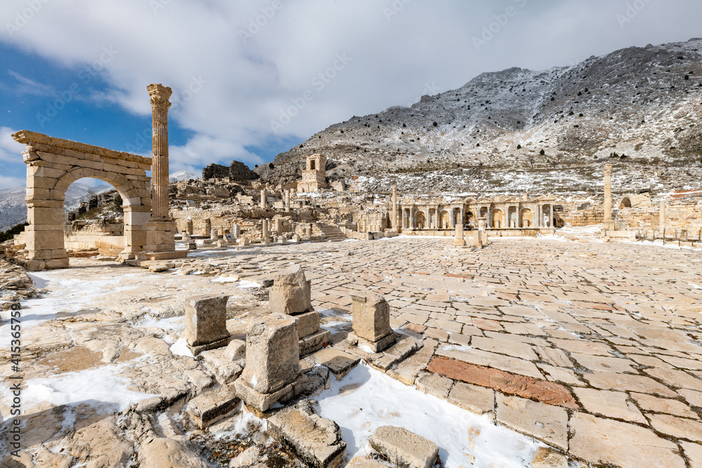 Fototapeta premium Gymnasium.Welcome to Sagalassos. Isparta, Turkey.To visit the sprawling ruins of Sagalassos, high amid the jagged peaks of Akdag, is to approach myth: the ancient ruined city set in stark.
