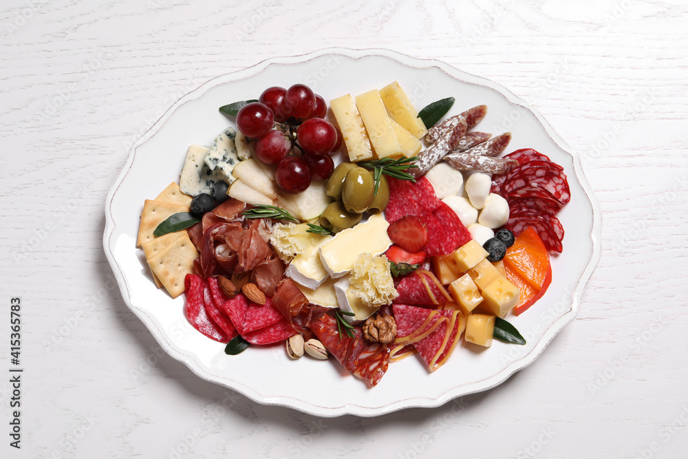 Assorted appetizers served on white wooden table, top view