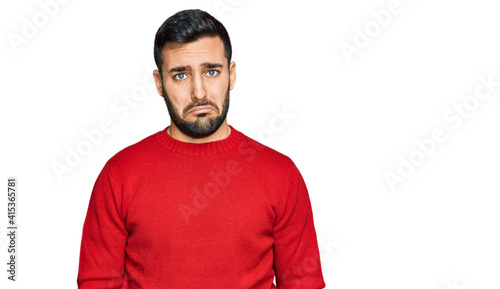 Young hispanic man wearing casual clothes depressed and worry for distress, crying angry and afraid. sad expression.