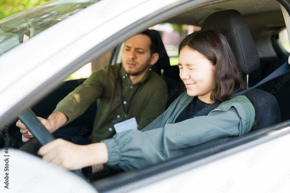 Teenage girl failing her driver's license exam