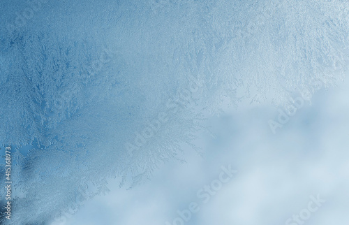Winter background, frost on window.