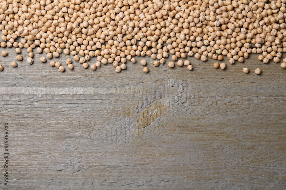 Chickpeas on wooden table, flat lay. Space for text Chickpeas on wooden table, flat lay. Space for text