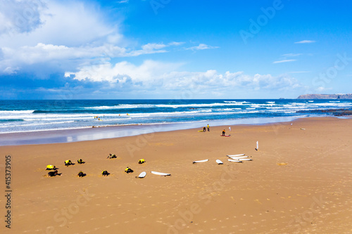 Vale Figueiras, Portugal - January 2, 2021: Surfers getting surflessons at Vale Figueiras beach in Portugal © Nataraj