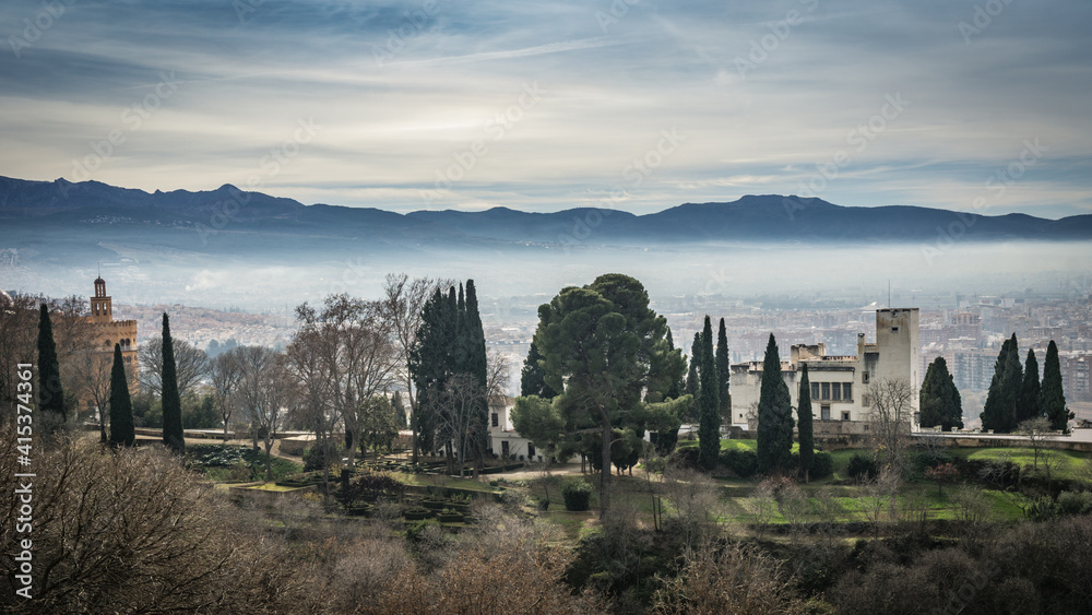 View on the Granada in Andalucia on a misty winter morning, from the Alhambra palace (Spain)