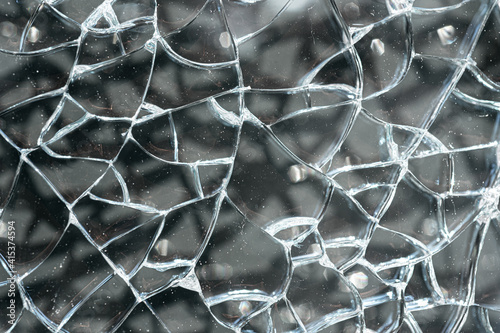 Broken toughened glass. The texture of the cracked glass photo