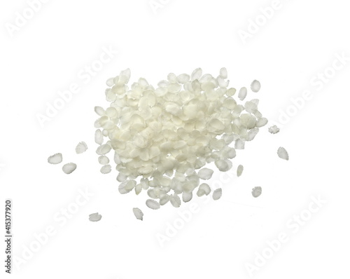 flattened rice flakes isolated on white.