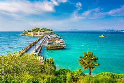 Fototapeta Naklejka Na Ścianę i Meble -  The road goes to Pigeon Island in Kusadasi. Kusadasi is a popular tourist destination in Turkey.