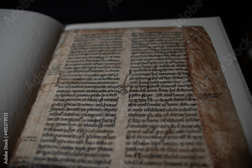 Medieval manuscript hand written on vellum with rubricated and illuminated initials, from a religious text from the C13th. 