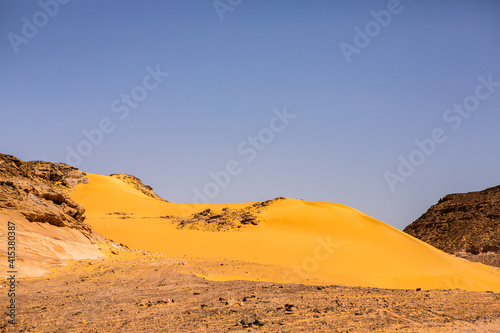 Beautiful landscape of sand dunes in Egypt. Sahara Desert. Background of orange sand wave. Africa desert © romeof