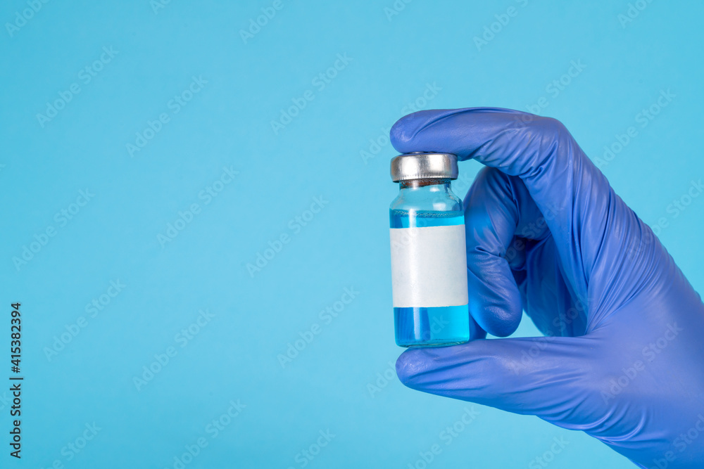 Naklejka premium Doctor, nurse, scientist hand in blue gloves holding flu, measles, coronavirus, covid-19 vaccine disease preparing for child, baby, adult, man and woman vaccination shot, medicine and drug concept.