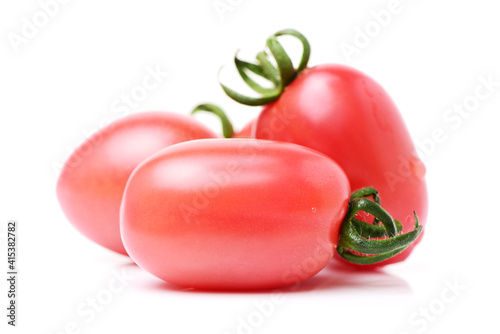 red cherry tomatoes on white background  photo