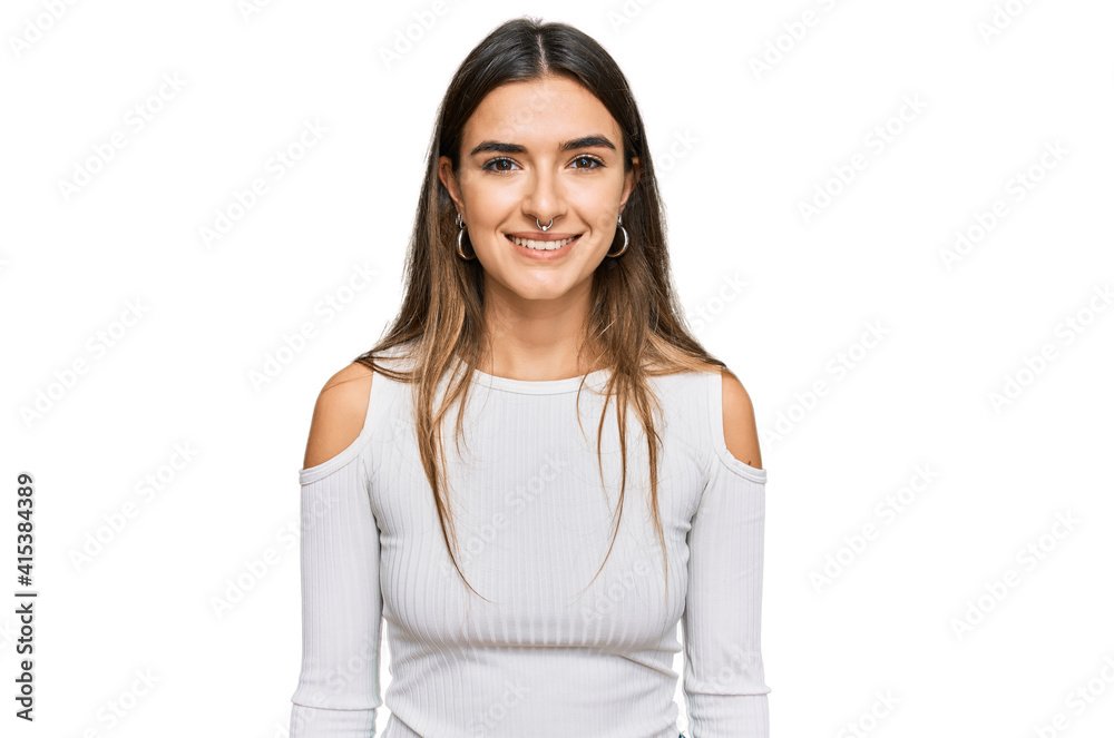 Young hispanic woman wearing casual clothes with a happy and cool smile on face. lucky person. Young hispanic woman wearing casual clothes with a happy and cool smile on face. lucky person.