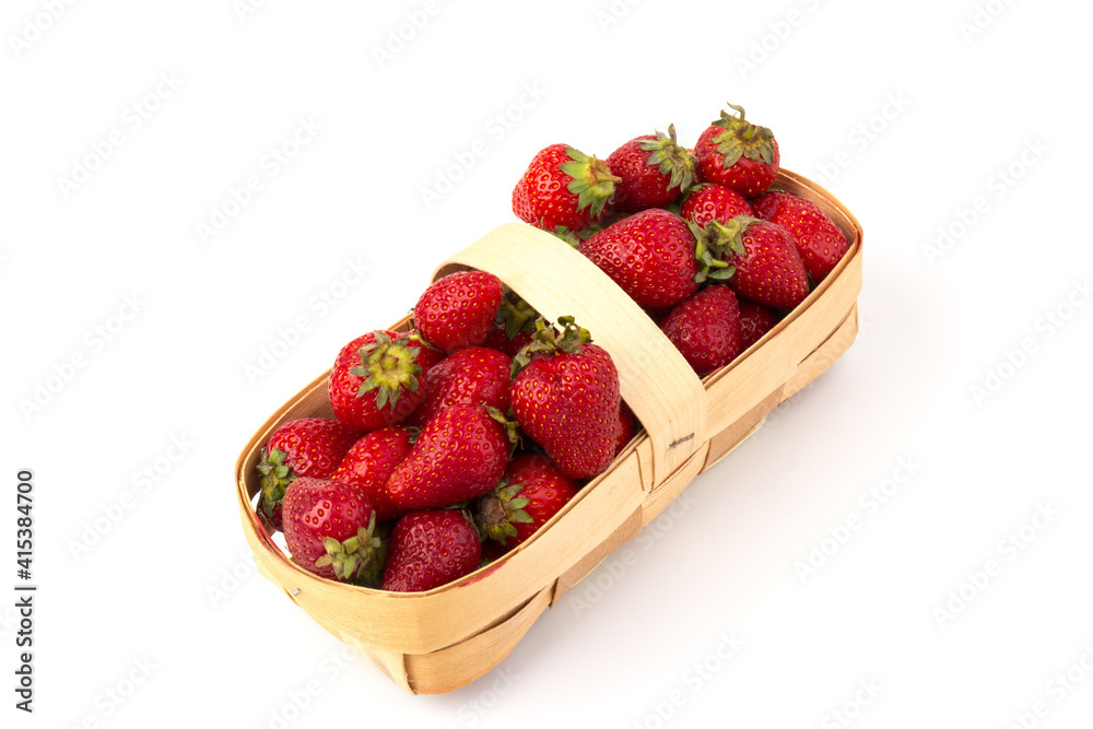 Fresh red strawberries in wooden basket on white background. Agriculture and ecological fruit farming concept. Fresh red strawberries in wooden basket on white background. Agriculture and ecological fruit farming concept.