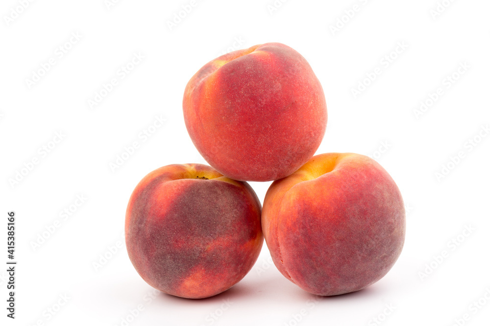 Summer fruit background. Ripe juicy peaches on white background. Copy space. Fresh organic fruit vegan food. Harvest concept Summer fruit background. Ripe juicy peaches on white background. Copy space. Fresh organic fruit vegan food. Harvest concept