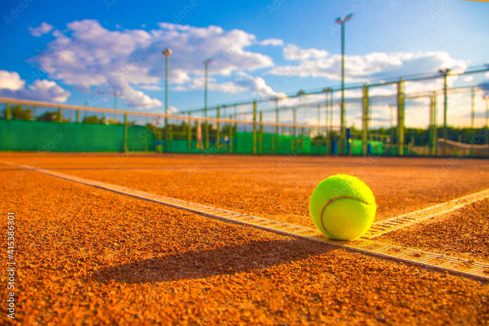 Tennis ball on the dirt court