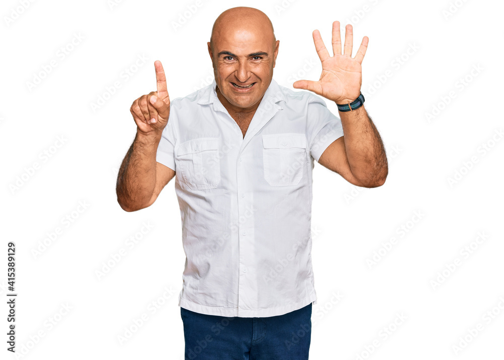 Mature middle east man with mustache wearing casual white shirt showing and pointing up with fingers number six while smiling confident and happy. Mature middle east man with mustache wearing casual white shirt showing and pointing up with fingers number six while smiling confident and happy.
