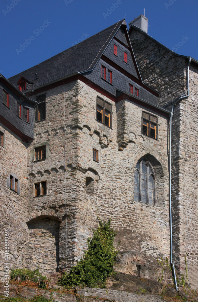 Medieval castle with gothic chapel window and renaissance facade on top of the old town of Limburg in Germany, Europe