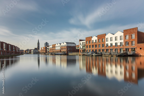 Vlaardingen, The Netherlands, February 2020: view of the Buizengat, residential buildings on the waterfront, cityscape