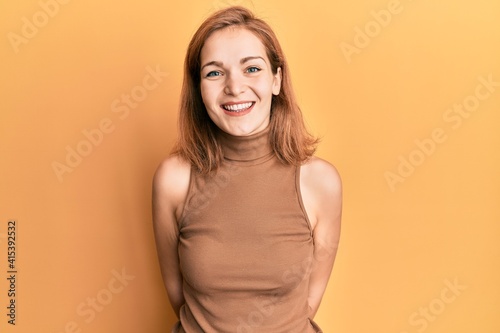 Young caucasian woman wearing casual style with sleeveless dress with a happy and cool smile on face. lucky person.