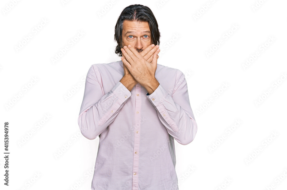 Middle age handsome man wearing business shirt shocked covering mouth with hands for mistake. secret concept. Middle age handsome man wearing business shirt shocked covering mouth with hands for mistake. secret concept.