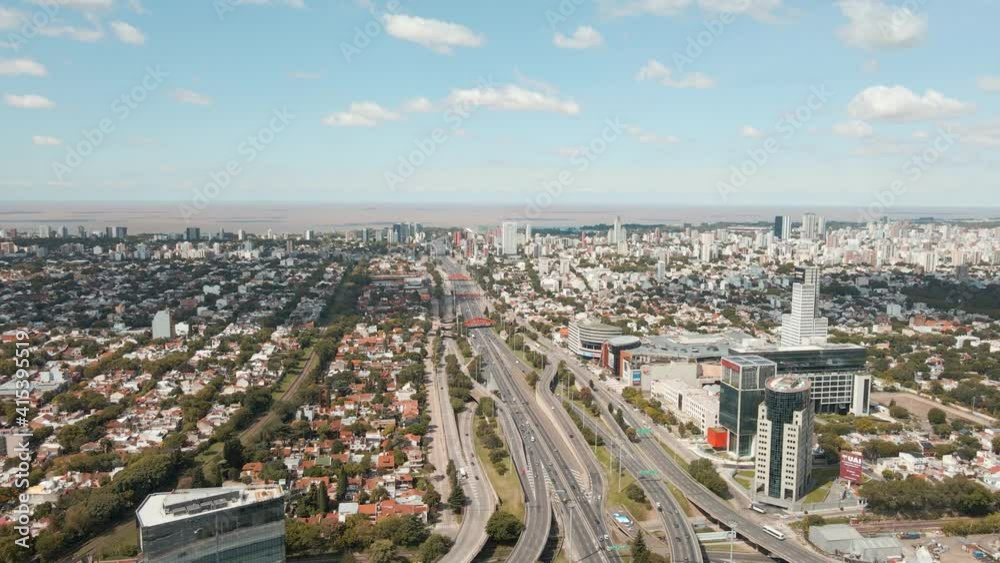 Aerial dolly right shot of General Paz Avenue, Buenos Aires city and La plata river Aerial dolly right shot of General Paz Avenue, Buenos Aires city and La plata river