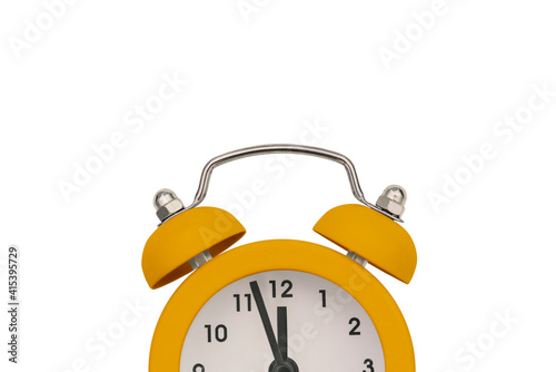 Yellow alarm clock on a white background with copy space. Antique clock. Sale reminder, hot prices. Deadline for the delivery of the project