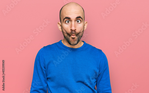 Young hispanic man wearing casual clothes making fish face with lips, crazy and comical gesture. funny expression. © Krakenimages.com