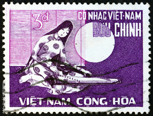 Postage stamp Vietnam 1966 woman playing 16-string guitar