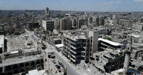 A syrian city from above. Some of the buildings are still in ruins after the civil war 10 years ago - aerial view with a drone 4K