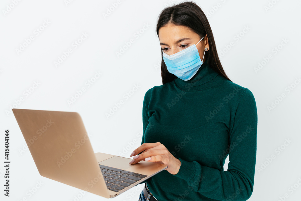Brunette young woman wearing medical face mask Brunette young woman wearing medical face mask