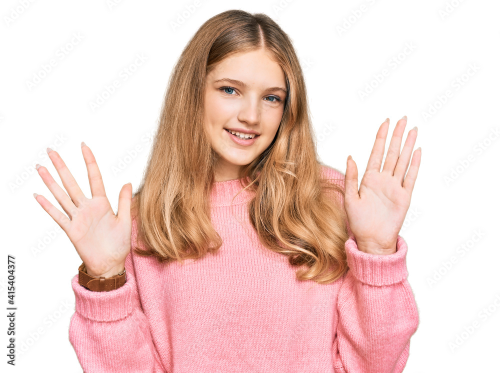 Beautiful young caucasian girl wearing casual winter sweater showing and pointing up with fingers number ten while smiling confident and happy. Beautiful young caucasian girl wearing casual winter sweater showing and pointing up with fingers number ten while smiling confident and happy.