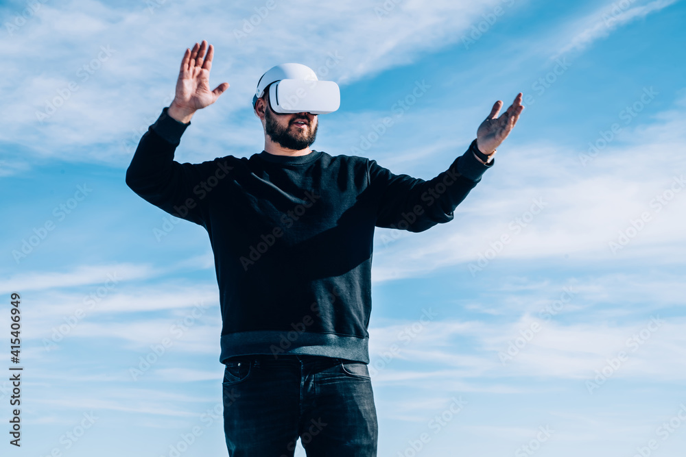 Astonished man in VR goggles in nature Astonished man in VR goggles in nature