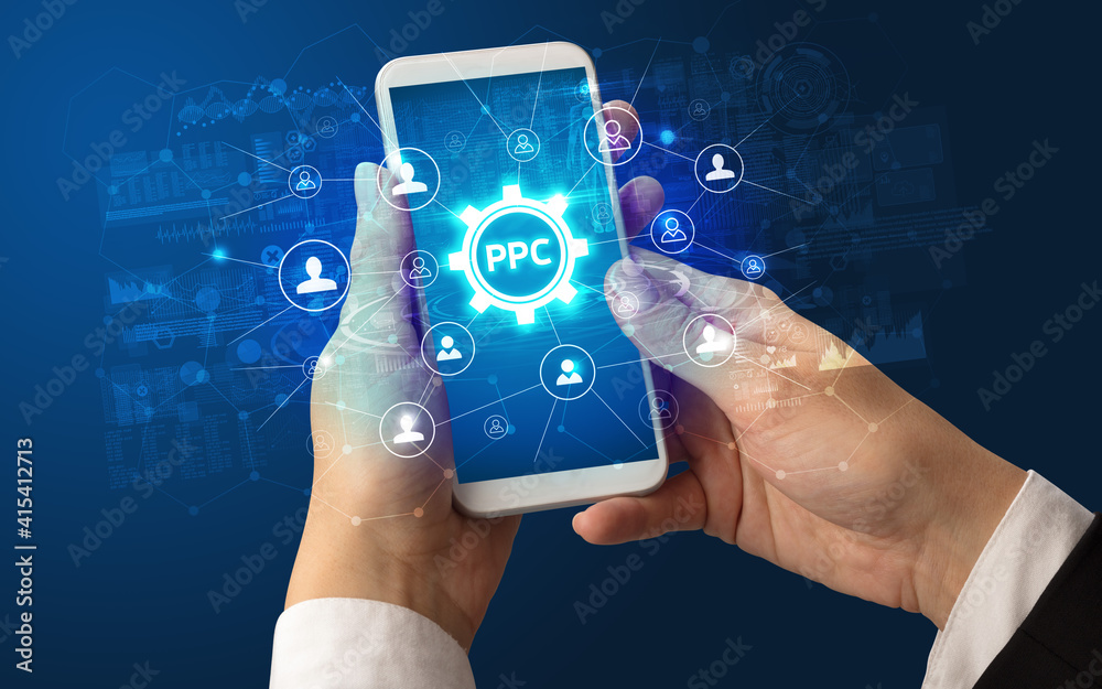Female hand holding smartphone with PPC abbreviation, modern technology concept