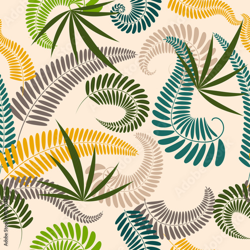 Tropical design. Colored leaves on a light background.