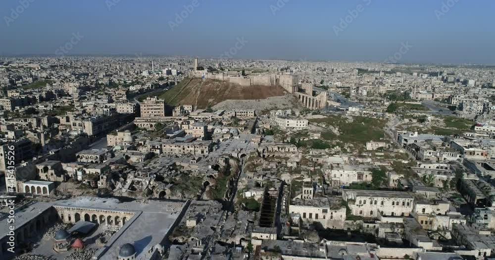 Aerial view of the city of Aleppo. We can see the citadel of Aleppo in the horizon - drone view 4K Aerial view of the city of Aleppo. We can see the citadel of Aleppo in the horizon - drone view 4K