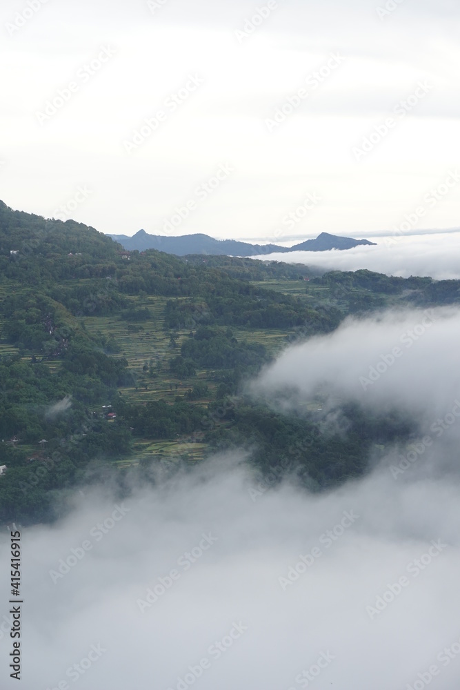 A breathtaking view when seeing beautiful morning light and the sea of fog at Lolai, Toraja Utara, Indonesia. This is the best place to see a sunrise